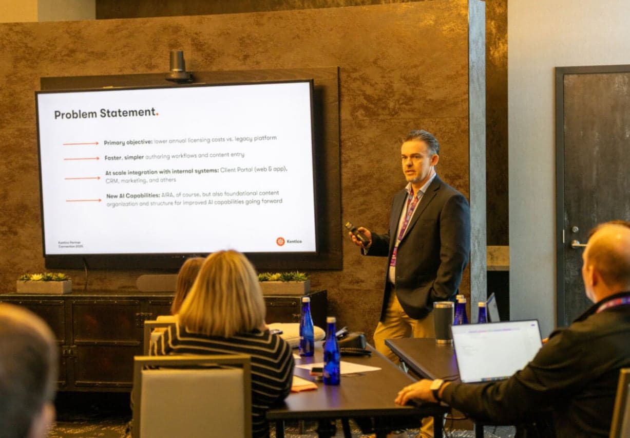 Mike Vallotton teaching a workshop with a presentation screen and participants in the room.